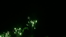Colorful fireworks explode in the dark sky. Stock Footage