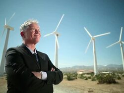 Businessman at a windfarm Stock Footage