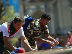 MS PAN two men cooling their faces with fountain water / Santiago, Valle Central, Chile Stock Footage