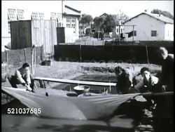 MOT 1948: REPUBLIC OF CHINA: FISHING INDUSTRY: VS Chinese men working government fish hatchery, catching young freshwater fish w/ drag net, moving small batches into bowl. WS Chinese men walking toward Bureau of Fisheries building. Instructional Video