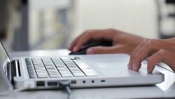 Closeup of business man hand using mouse and typing on laptop keyboard Stock Footage