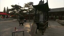 Incense burns in the courtyard of the  Bai Yun Guan Temple in Beijing. Stock Footage