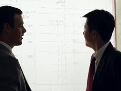 MS Two businessmen discussing in front of white board / China Stock Footage