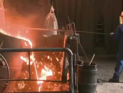 MS  Worker working at inductive heating furnace of foundry / Juenkerath, Rhineland-Palatinate, Germany  Stock Footage