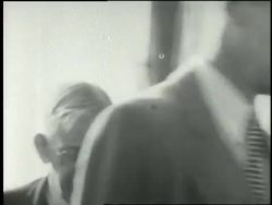 Families stand in a bread line at a soup kitchen. News Clip