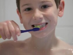 Boy Brushes Teeth in Shower Stock Footage