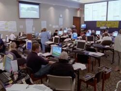 September 2005 High angle volunteers working on computers at Hurricane Katrina relief command center / Alpharetta, Georgia Stock Footage
