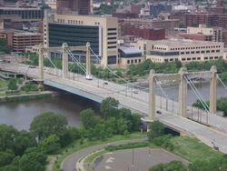 MS Cars passing through bridge over river / Minneapolis, Minnesota, United States  Stock Footage