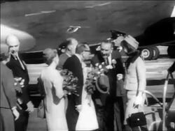 B/W 1963 people greeting John + Jacqueline Kennedy at Dallas airport / newsreel Stock Footage