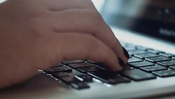Female hands typing on a laptop close-up Stock Footage