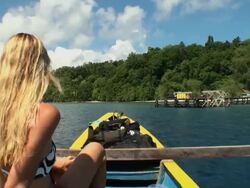 Woman traveling by boat towards Indonesian fishermen's Island Stock Footage