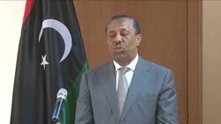 Interim PM orders forces guarding cabinet building to stand down to avoid bloodshed News Clip