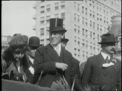 United States President Woodrow Wilson watches his inaugural parade from a grandstand. News Clip