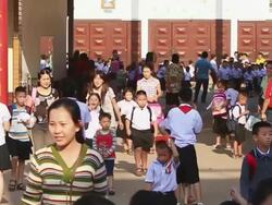 WS ZI SLO MO School childrenwalking out after  school hours / Vientiane, Laos  Stock Footage