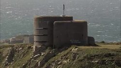 Alderney,  WW11 bunker - Aerial View - helicopter filming,  aerial video,  cineflex,  establishing shot,  Guernsey Stock Footage