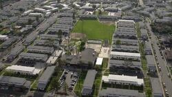 Watts, Los Angeles - March 30, 2011: Aerial view of Nickerson Gardens housing project and basketball courts in Watts, Los Angeles Stock Footage