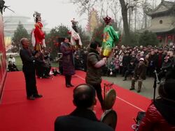 MS PAN Chinese artists performing puppet show at temple fair to celebrate Chinese spring festival AUDIO / xi'an, shaanxi, china Stock Footage