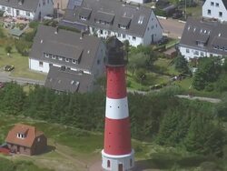 MS AERIAL DS Shot of light house / Sylt, Schleswig Holstein Stock Footage
