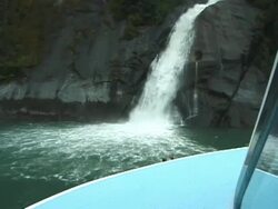 Approaching Melting Glacial Waterfall on Boat, Push Stock Footage