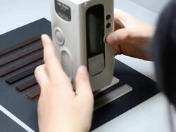 measure on center of sample with Color Meter Stock Footage