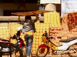 MS SLO MO Shot of woman taking panel of cassava crackers and putting it in sun / Luang Prabang, Laos Stock Footage