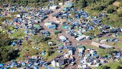 CLEAN : Calais  Migrants staying in zone with dangerous substances News Clip