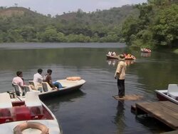 Pan Left Shot Boats in Pookot Lake Kerala India Stock Footage