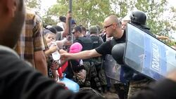 CLEAN : Barbed wire and stun grenades welcome refugees to Macedonia News Clip