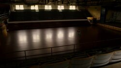 An athlete practices basketball in an empty gym. Stock Footage