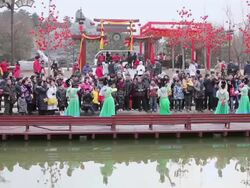 WS Woman dressed in traditional costumes showing traditional ceremony during chinese spring festival AUIDO / xi'an, shaanxi, china Stock Footage
