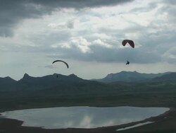 Paragliding over the lake Stock Footage