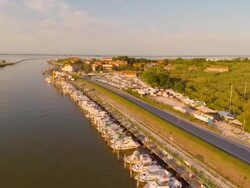 Aerial flight over harbor in Po river delta Stock Footage