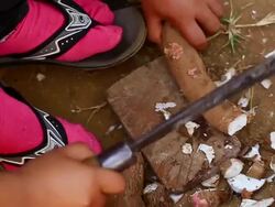 CU SLO MO Shot of cutting of cassava roots with machete / Luang Prabang, Laos Stock Footage