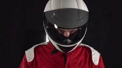 Motorcyclist / Formula One Driver looking up - Slow motion Stock Footage