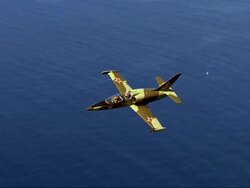 AIR TO AIR, Aero L-39 Albatros flying over ocean Stock Footage