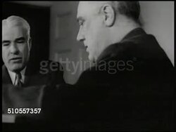 1939: U.S. WORLD WAR II: STETTINIUS & ROOSEVELT: EXT MS White House Executive Wing entrance. INT VS Secretary of State Edward R. Stettinius Jr (1900-1949) & Pres. Franklin Roosevelt sitting at table. VS Stettinius & FDR talking. Washington D.C. Instructional Video