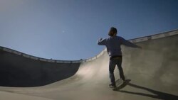 skater skates in dog bowl around camera venice California skatepark Stock Footage