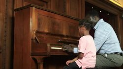 Father and Daughter play piano Stock Footage