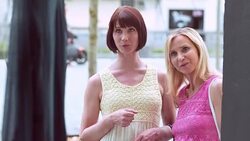 TU Female friends looking at display window of a shop Stock Footage