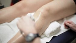 Patient Leg Pain Treatment with Ultra Sound at Clinic Health Center Stock Footage