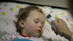 Mother taking the son's temperature Stock Footage