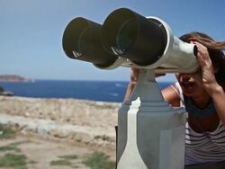 Woman using binoculars Stock Footage