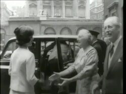 May 6. 1961 FILM MONTAGE MS Crowd/ MS Harold Macmillan greeting John F. and Jacqueline Kennedy/ Harold and Lady Dorothy Macmillan seeing the Kennedys off/ MS Crowd waving/ MS Kennedys entering building/ MS Crowd waving/ London, England Stock Footage