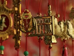 CU Depicting gold decorations hanging from red strings / Singapore, Singapore, Singapore Stock Footage