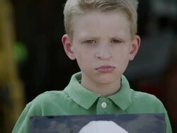 Slow motion from photo to boys face of him showing photo with cleft palate. Stock Footage