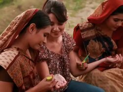 Two young women applying henna, Haryana, India Stock Footage