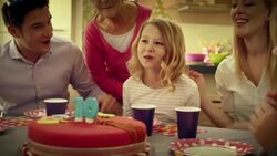 SLO MO blowing out the candles for tenth birthday Stock Footage