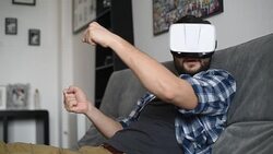 Young adult man and a virtual reality headset. Guy using vr glasses Stock Footage