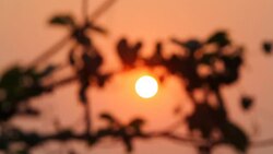 Sunrise through flowing cloud waves, mountain Stock Footage