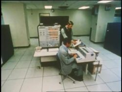 Technicians work on different machines in a computer room. Stock Footage